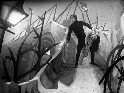 Scene from the horror movie The Cabinet of Dr Caligari showing sleepwalker Cesare carrying one of his victims. 