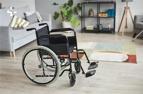 Picture of a wheelchair in a living room. 