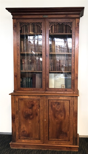 Picture of the cabinet that once belonged to May Bain and was bequeathed to the library. 