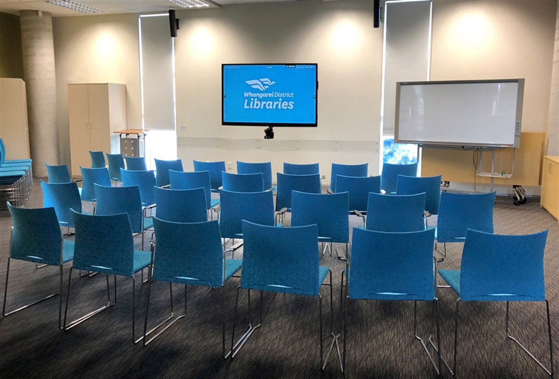 Picture of the May Bain Room set up with chairs in conference layout.