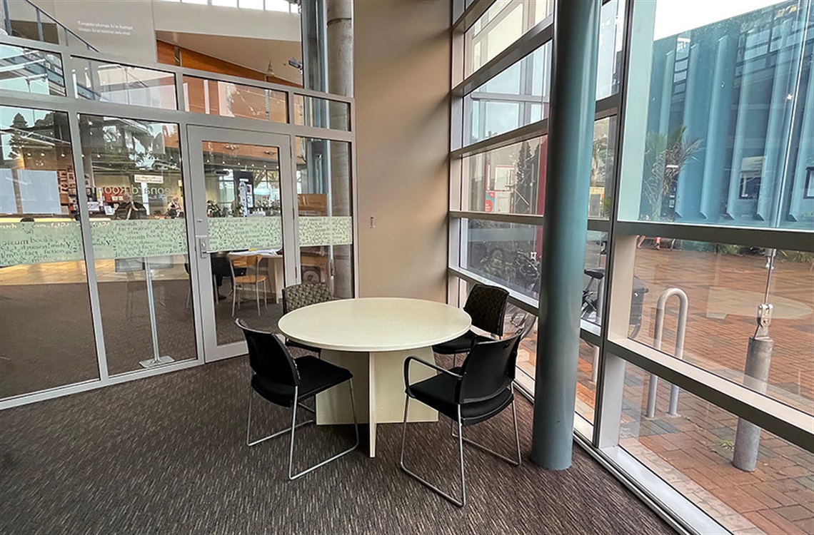 Picture the meeting table and chairs in the Leonard Room at Whangārei Central Library. 