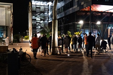 Guests gather in the rain for the dawn opening of the new Lovers Lane and Bridge.