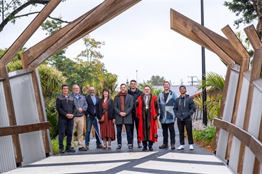 Mayor Vince Cocurullo and guests gather at the end of Lovers Lane Bridge after the dawn blessing.