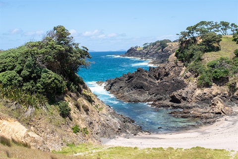 A photo of Huitau (The Gap) showing the ocean on a sunny day.