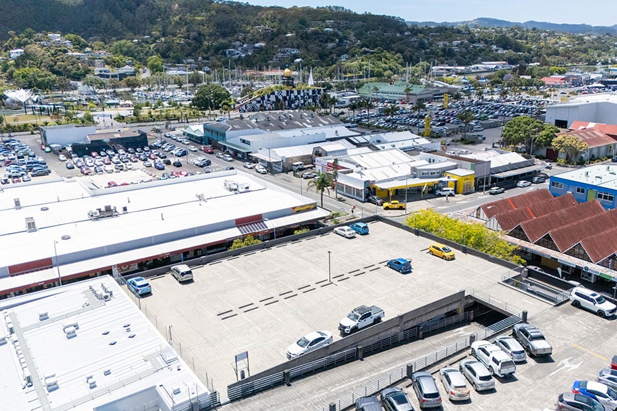 An aerial view over the city centre showing the tops of parking buildings. 