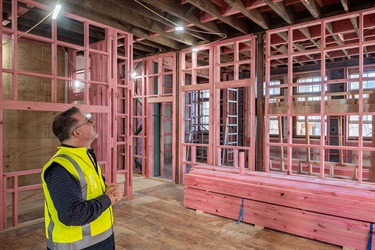 Mayor Vince Cocurullo looking up at restoration work in the Old Municipal Building.