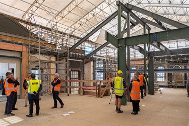 Upper floor in the Old Municipal Building. A large metal structure reaches the ceiling in the centre of the room.