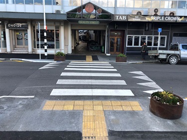 Vine Street traffic improvements are now complete with the raised platform transformed into an official pedestrian crossing, featuring new signs, lights and enhanced drainage.