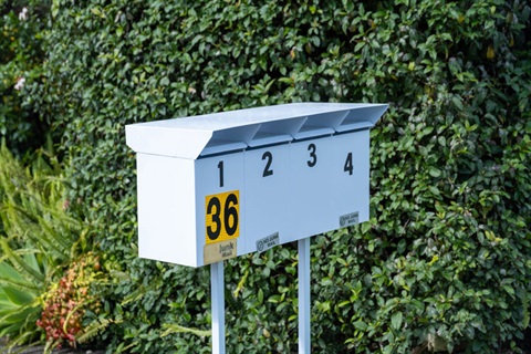 Image of letterboxes in front of a residential property. 