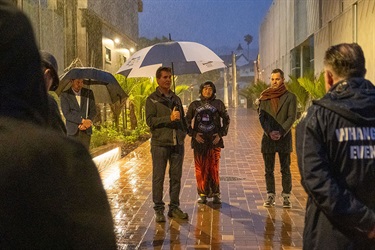 Guests gather in the rain for the blessing at the dawn opening of the new Lovers Lane and Bridge.