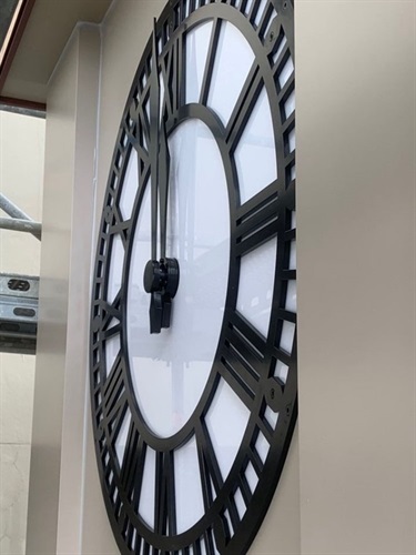 A clock face on the wall of the Old Municipal Building.