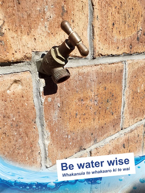 Photo of an outdoor water tap. 