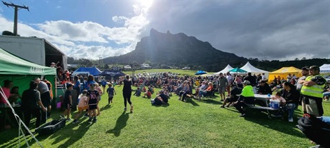 Image of people and gazebos set up for the Funky Fishing event. 