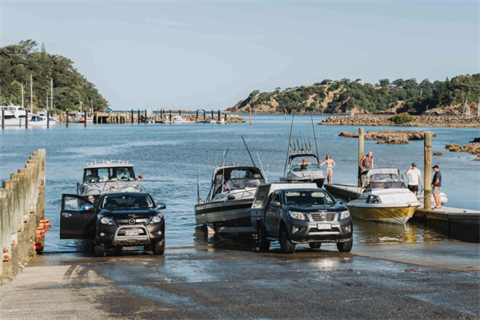 Image of boats launching from the jetty. 