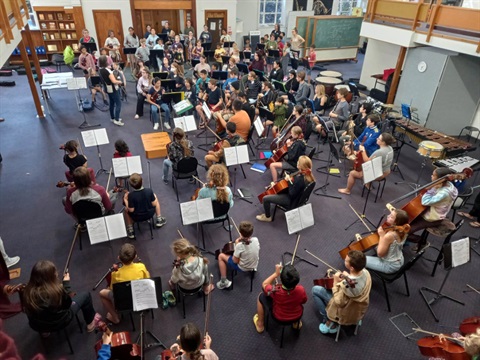 Image of the Sistema Youth Orchestra practicing. 