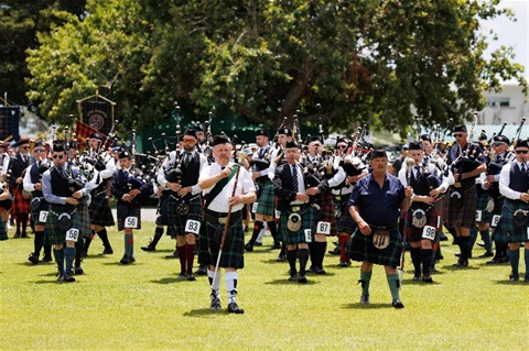 Image of Bagpipe players on the field.