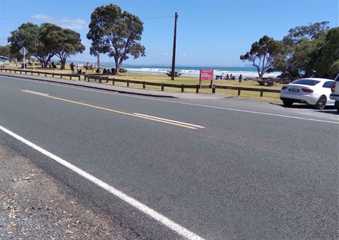 An image of the Waipu Cove road showing beach in the background. 