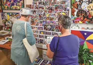 Older adults enjoying an art exhibition during Silver Festival.