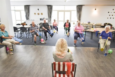 A group of older adults enjoying a session at Sit Fit Exercise Class.