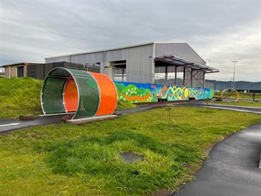 Tunnels and mural on beginner skills track at Bike Park on Pohe Island. The colourful mural next to the beginners area was created by artist Lucinda Skye.