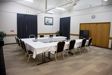 Bounty Room boardroom layout with chairs and tables setup.