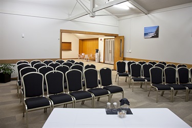 Bounty room in a theatre layout with chairs setup, facing the front.