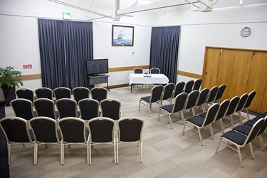 Bounty Room behind angle setup in a theatre layout with chairs setup.