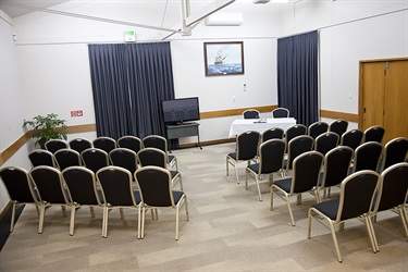 Bounty Room theatre layout with chairs setup behind angle.