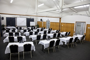 Cafler Suite classroom layout, behind angle with tables and chairs setup.