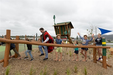 Mayor playing with the kids at the opening of the Pohe Island destination playground.