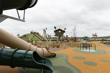 View of play equipment at the Pohe Island destination playground.