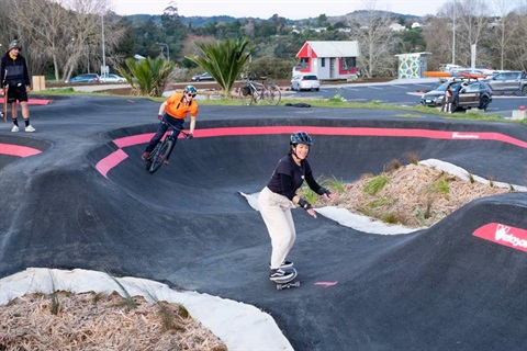 Cyclists and skaters on Pump Track at Bike Park on Pohe Island. 