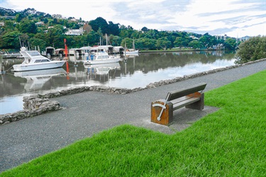 A bench facing the water on the Hatea loop.