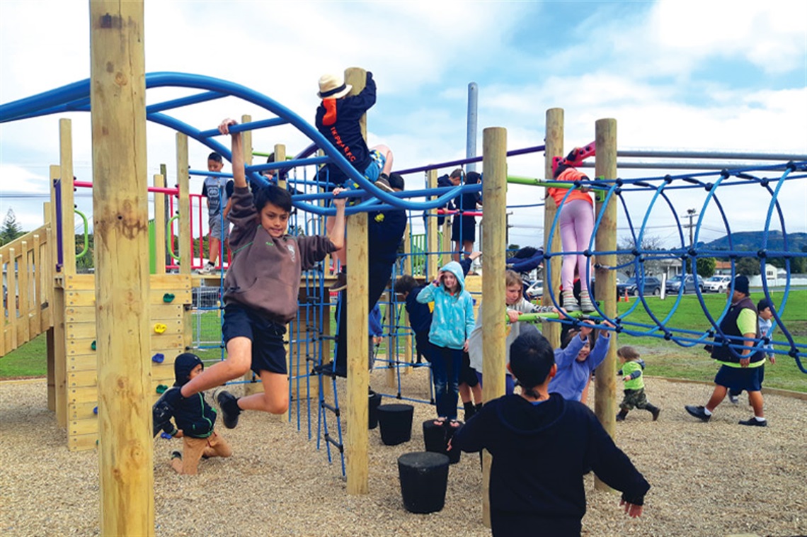 Photo of children playing on the playground at Potter Park. 