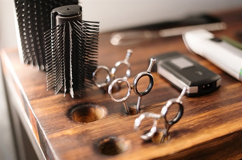 Image of a hairdressing salon, scissors, brushes and razors. 