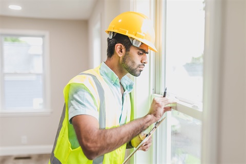 Image of a building inspector for Building Inspections fees page.